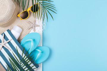 Beach accessories on the blue background