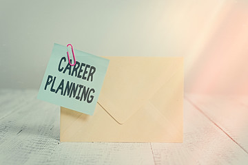 Text sign showing Career Planning. Business photo text Strategically plan your career goals and work success Standing rectangular colored envelope sticky note clip wooden background