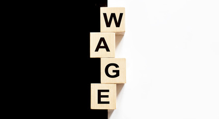 Business concept text on wood block Wage on the black and white background