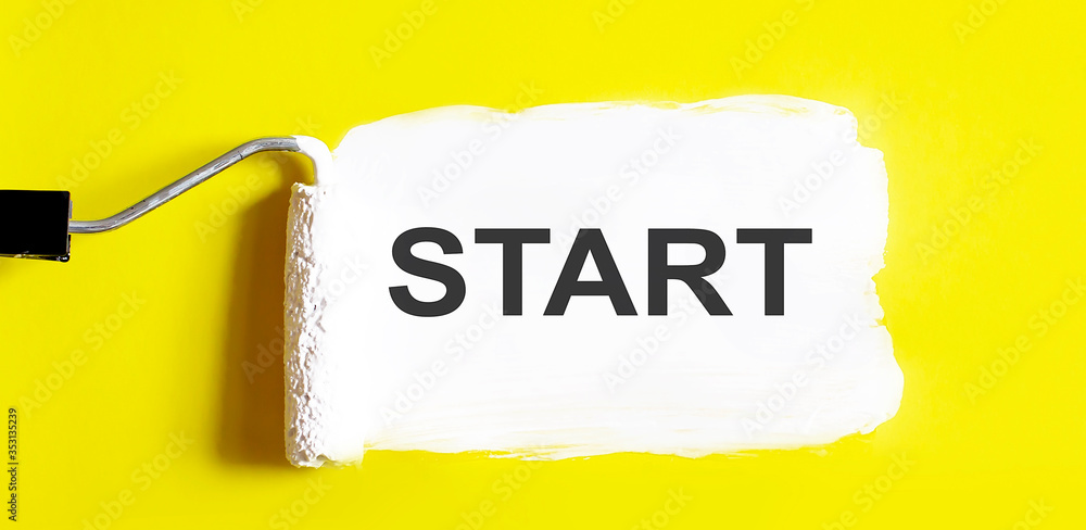 Poster start. one open can of paint with white brush on it on yellow background. top view. repairing concep