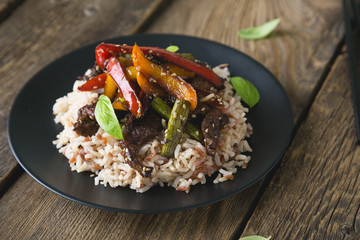 rice with beef and fried vegetables in soy sauce