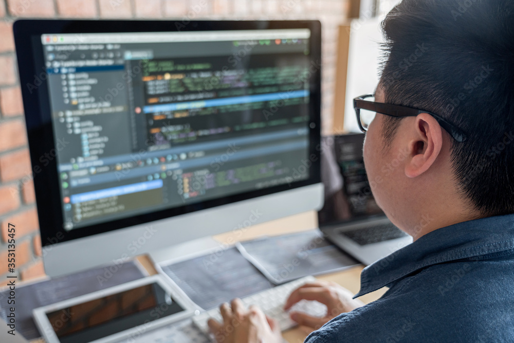 Aufkleber Young Professional programmer working at developing programming and website working in a software develop company office, writing codes and typing data code, Programming with HTML, PHP and javascript