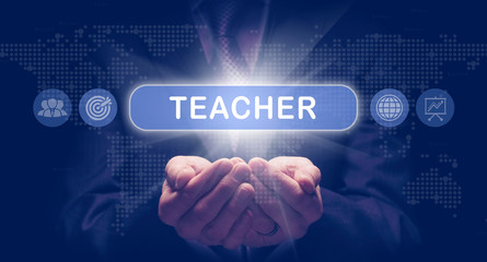 Businessmans cupped hands holding an Teacher business concept on a computerised display.