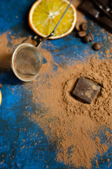 slice of dark chocolate in cocoa powder