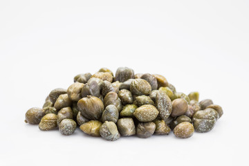 Capers isolated on a white background. Bunch canned pickled or salted capers.