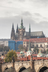 Panorama of the Old Town of Prague, Czechia, with Hradcany hill, Prague Castle,St Vitus Cathedral (Prazsky hrad) and Charles Bridge (Karluv Most) seen from the Vltava river.
