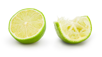 Fresh lime cut in half with drop shadow on white background. Commercial image of citrus fruits...