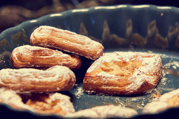 Bun with powdered sugar close-up. Baking, pastry.