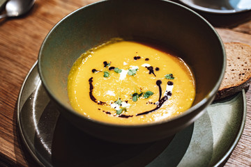 Creamy pumpkin soup drizzled with soy sauce