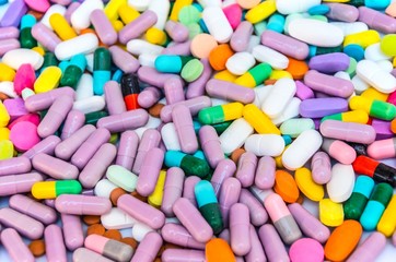 Fototapeta na wymiar pharmaceuticals antibiotics pills medicine /colorful antibacterials pills on white background /capsule pill medicine