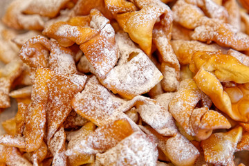 Sweet deep fried brushwood dessert traditional cookies with powdered sugar