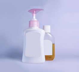 plastic bottle with soap liquid and germs killing liquid