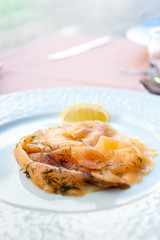 seafood salad with smoked salmon, fresh lettuce and lemon