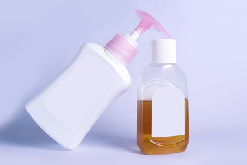 plastic bottle with soap liquid and germs killing liquid