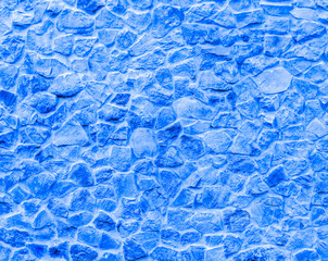 texture of old blue stone wall close up , retro neon bricks background macro , bricklaying surface backdrop