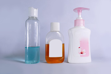 bottles of liquid soap sanitizer and germs killing liquid