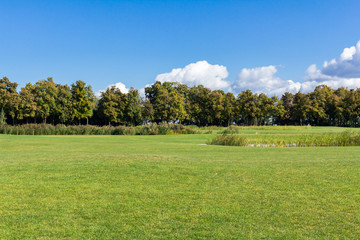 Golf course with a rich green turf beautiful scenery.
