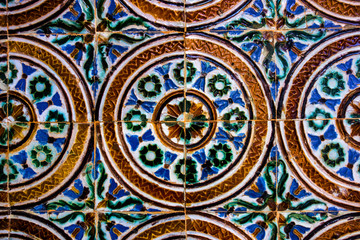 Fototapeta na wymiar Traditional tiled wall decoration in a city palace in Seville, Spain 
