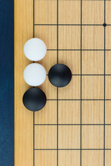 Simple training position of black and white stones on the playing field (gohan) of Chinese game go