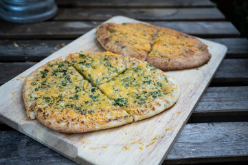 indian bread with herbs, cream and grated cheese as starter