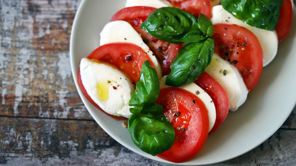 Selective focus. Italian caprese salad. Cooking at home.