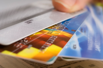 hand holds plastic bank card