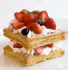 Mini fruit cake with fresh berries.