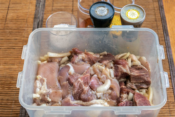 Pieces of chicken fillet in marinade for cooking shish kebab	