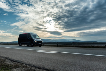 Delivery van on the highway road at sunset. Transports, logistics concept. © Ivan