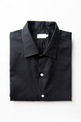 New Black Men's shirts Folded on white background,