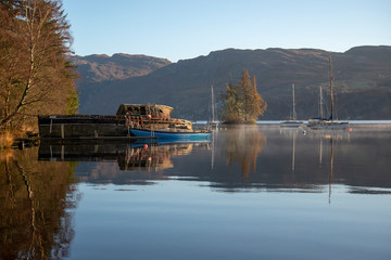 Fototapeta na wymiar Loch Ness early light on a wrecked boat