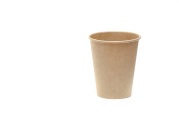 Brown paper cup for coffee, tea, a drink from environmental materials on a white background. A small cup in macro is on the right. Front view and top view, bottom visible. Place for text on the left