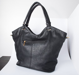 London, England, 20/02/2020 Black real authentic leather bag shot on a white background ready for photoshop composition for e commerce product photography by professional for editing
