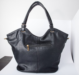 London, England, 20/02/2020 Black real authentic leather bag shot on a white background ready for photoshop composition for e commerce product photography by professional for editing