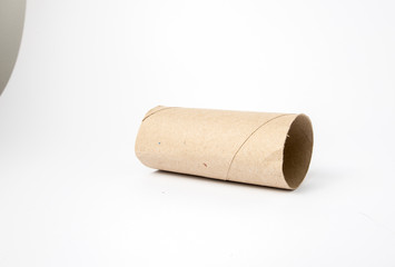 Image of cardboard toilet paper roll shot on white background in a studio with professional lighting for ecommerce. global pandemic people stacking up on toilet roll bulk buying and running out