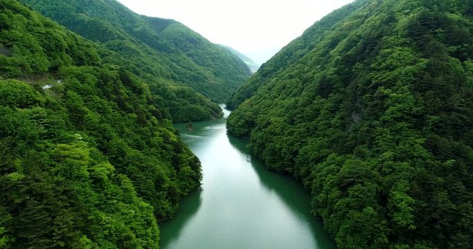 Aerial : Huge dam in Japan. Fly forward.