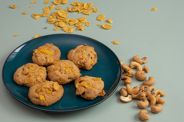 Cookies Corn flakes on light green background
