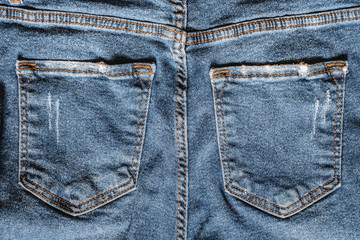 Details from jeans pants with seams and pockets