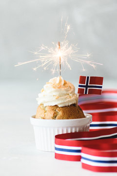 Muffin with candle and norwegian flag