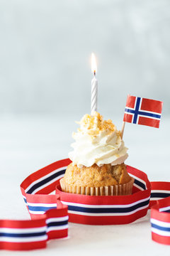 birthday cake with candles and norwegian flag
