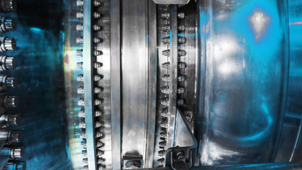 A detailed view of the gas turbine engine for generating electricity, shows the bolt connection design and the pipe laying outside. © Alexander