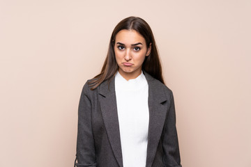 Young girl over isolated background sad
