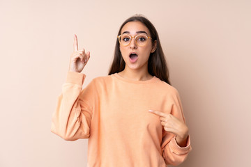 Young girl over isolated background with surprise facial expression