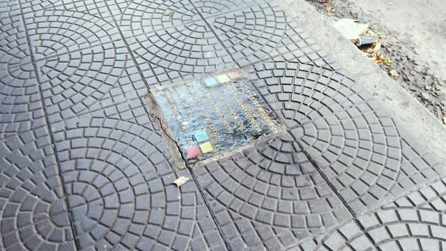 A Commemorative Plaque mark the Spot where a Woman was Disappeared in Buenos Aires during the Dictatorship of Argentina in the 70s. Zoom In. 