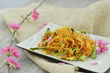White plate with shredded dried chicken in lunar new year