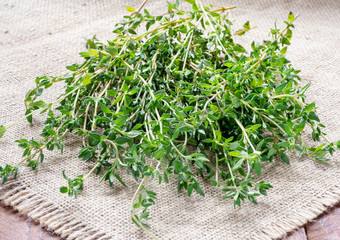 Fresh green thyme on burlap