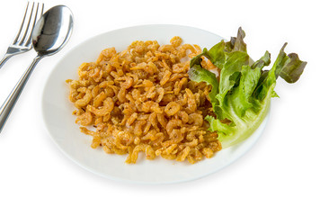 Fried Dried Shrimp on white round plated with fork and spoon.