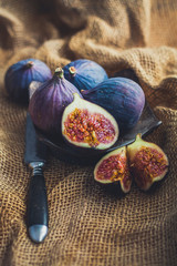 Juicy figs in a rustic style on natural canvas.