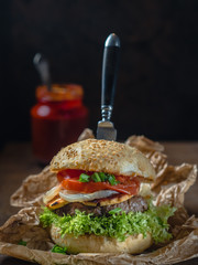 Homemade hamburger with regional cheese, tomatoes, eggplant and onion.