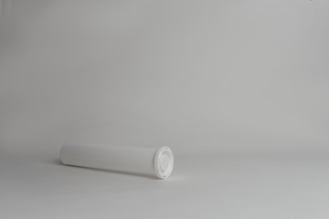 closed white box for medical tablets on a white background